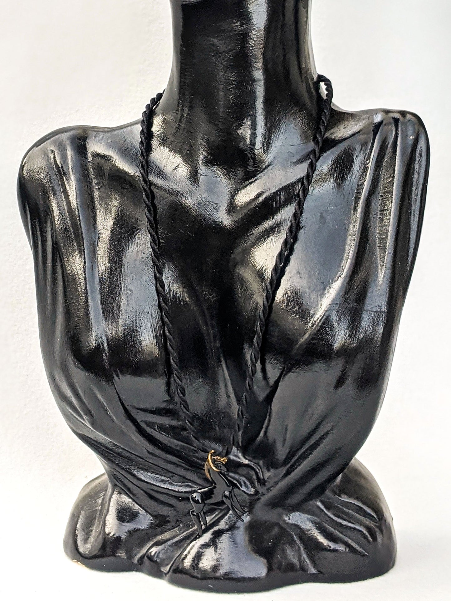 Black rope necklace with a glass horse