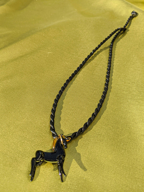 Black rope necklace with a glass horse